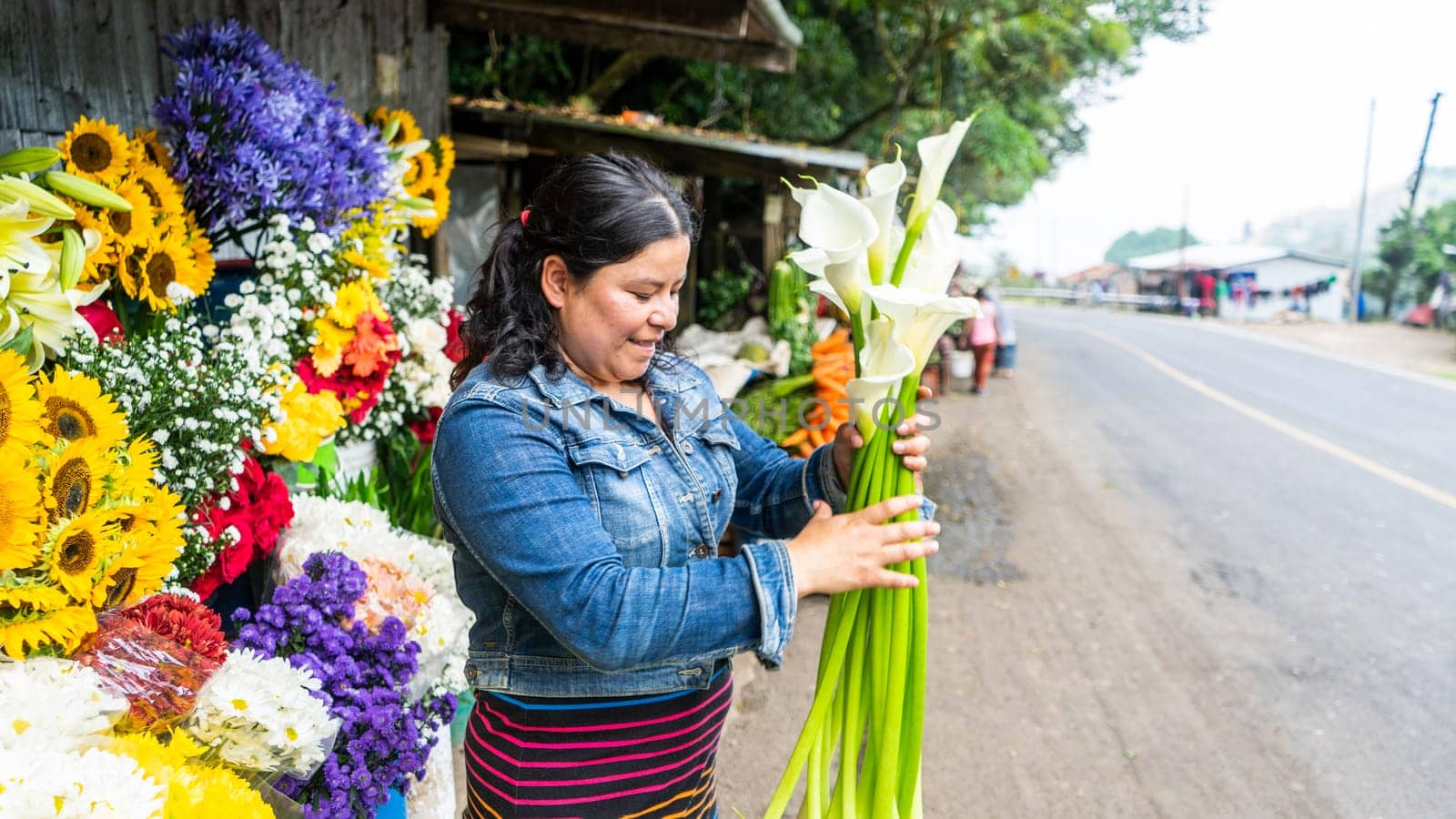 Woman Flower seller contributing to the local economy in Nicaragua, Central America, Latin America by cfalvarez