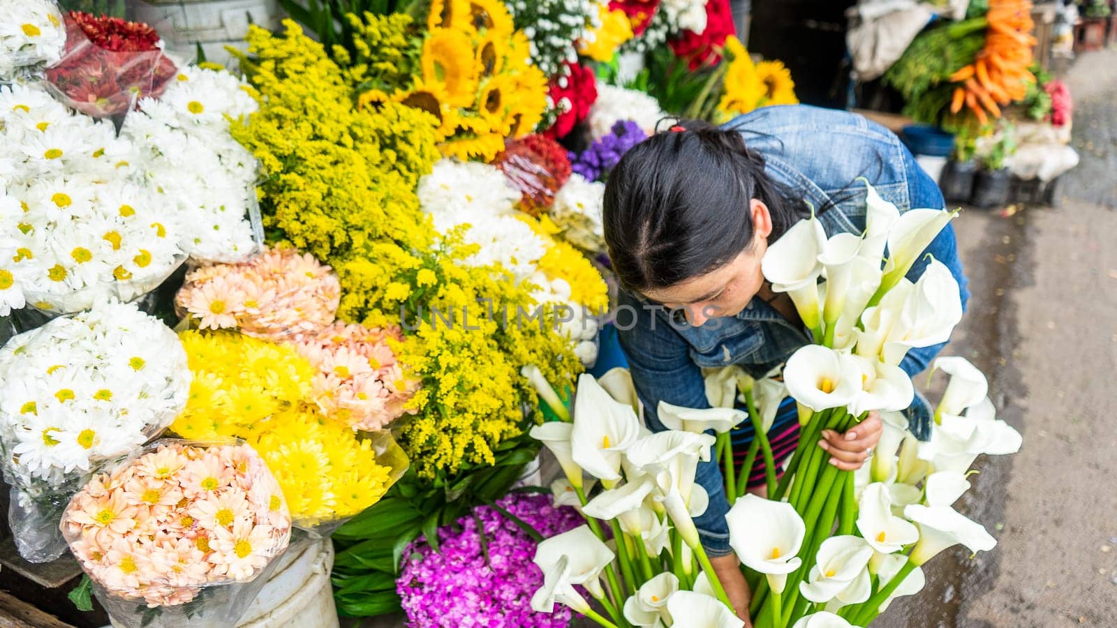 Woman tending a small retail business selling flowers in Nicaragua, Latin America, Central America