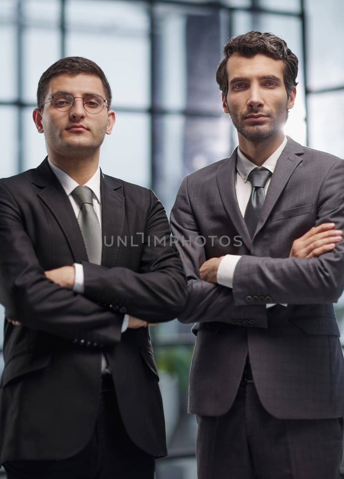 Two men business workers standing with arms crossed gesture at office by Prosto