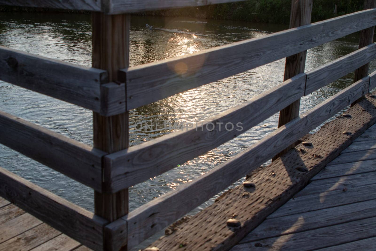 Wood bridge rail over river close up old . High quality photo