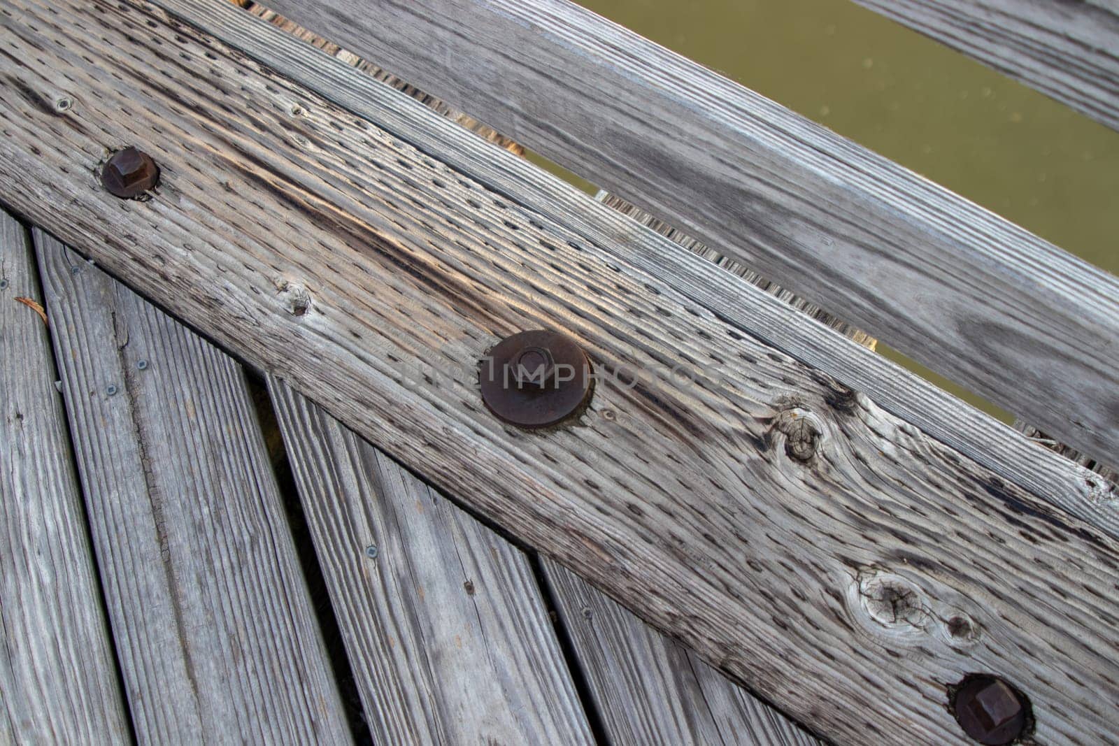 Wood bridge board bolts close up old by gena_wells