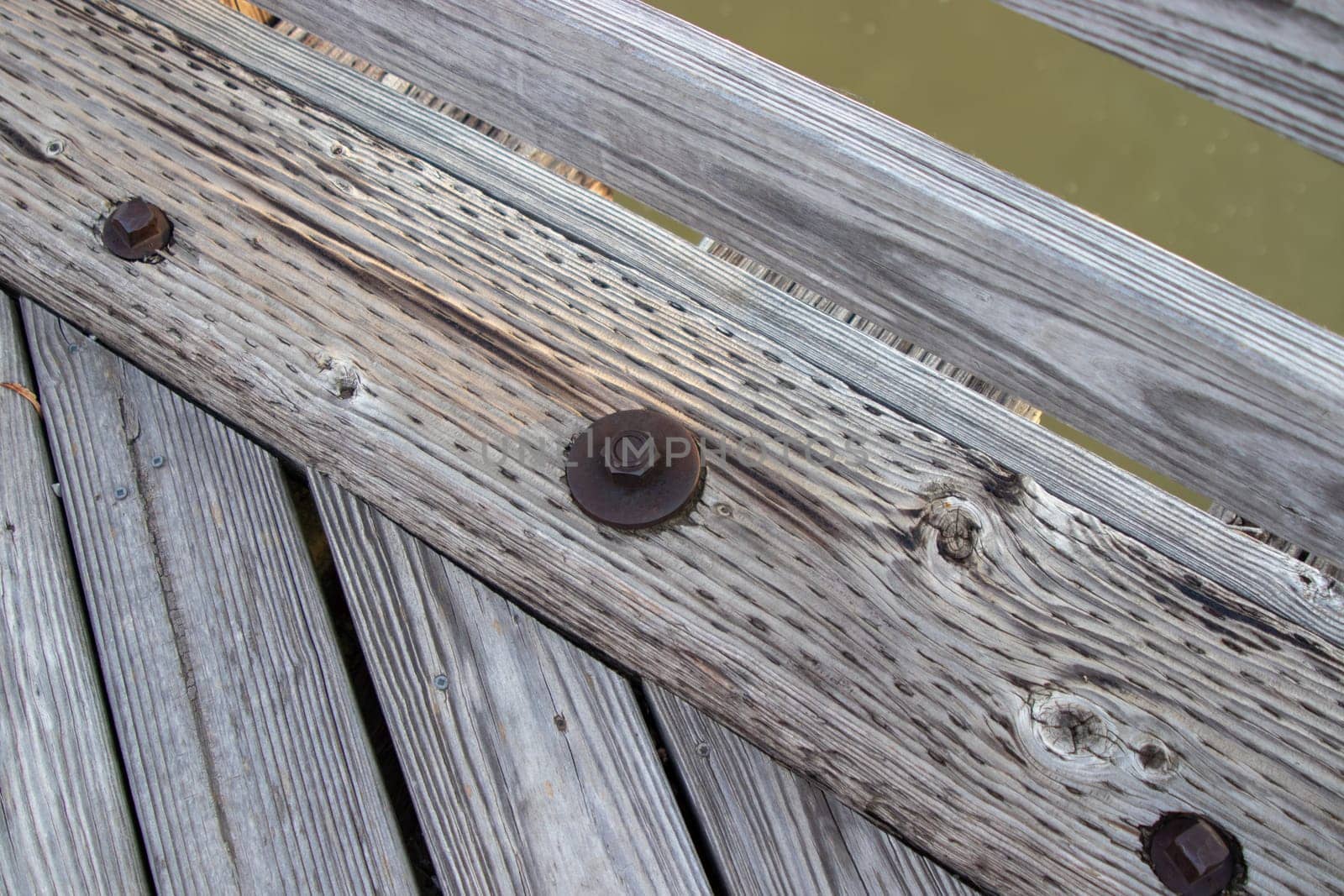 Wood bridge board bolts close up old . High quality photo