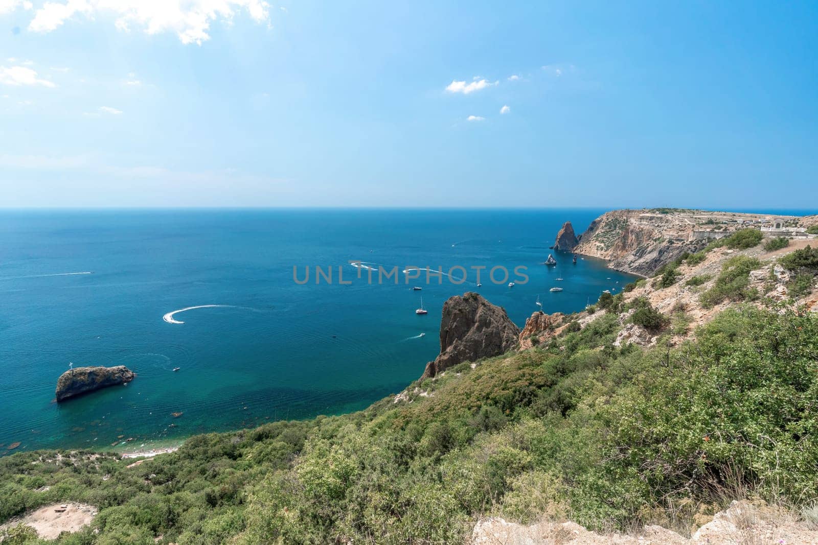 Sea lagoon. Panoramic view on calm azure sea and volcanic rocky by panophotograph