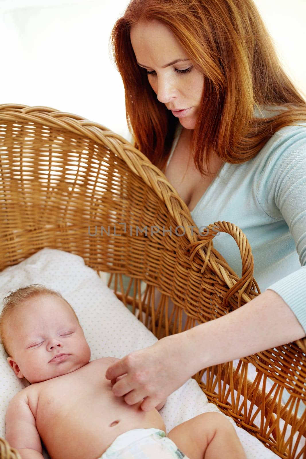 Im right here. a loving mother checking her sleeping baby in a crib