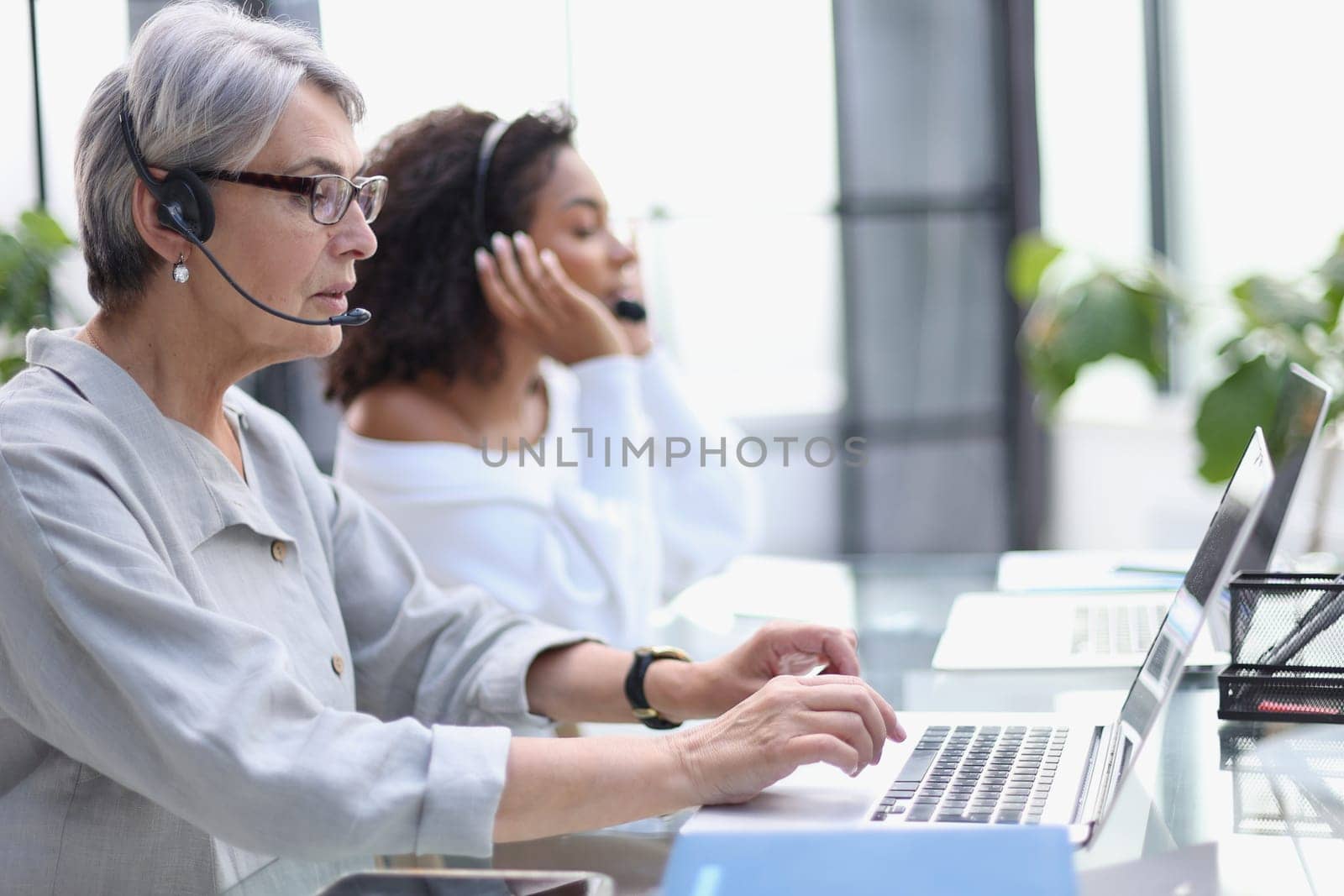 businesswoman working with a headset and accompanied