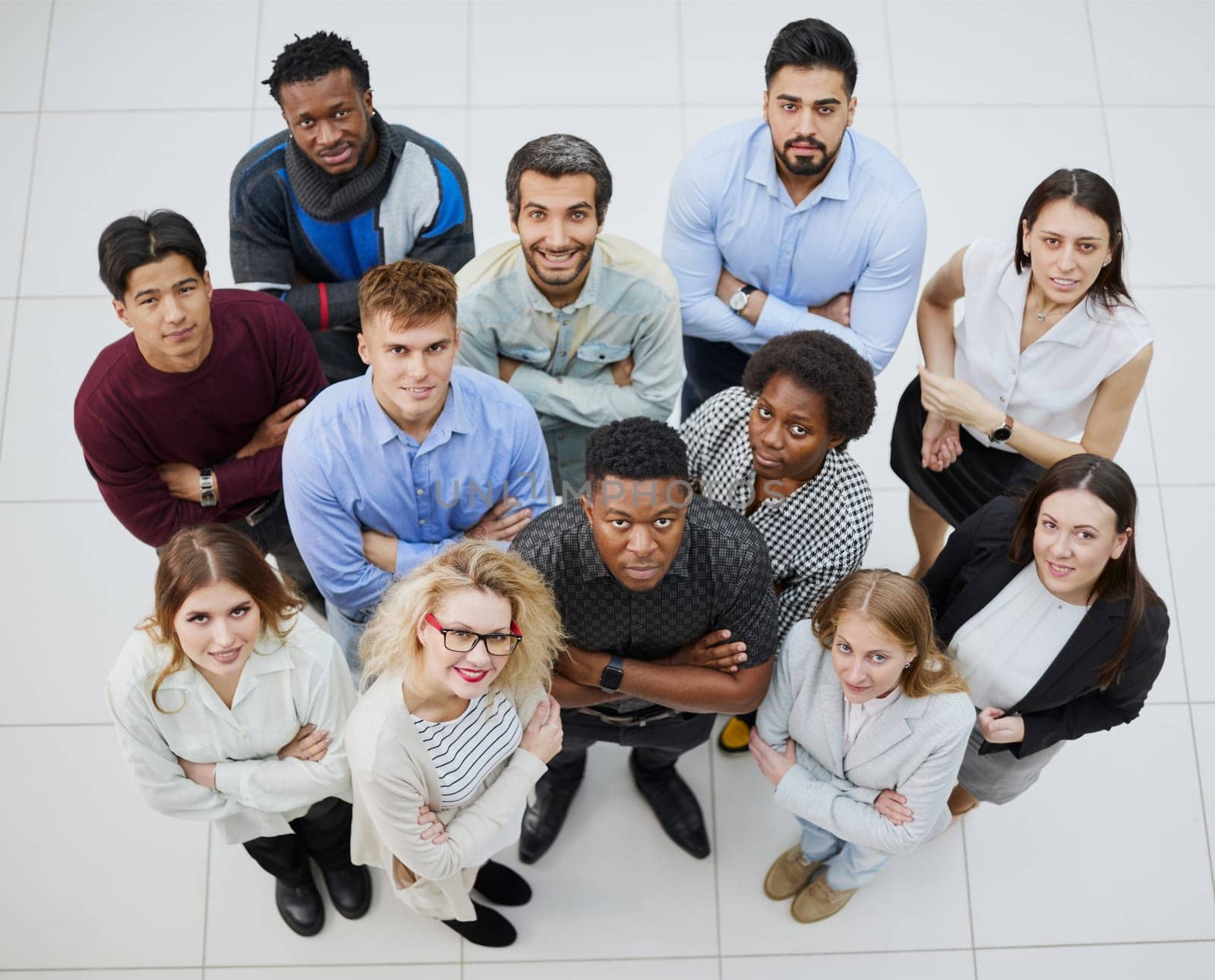 Group of young different people looking up