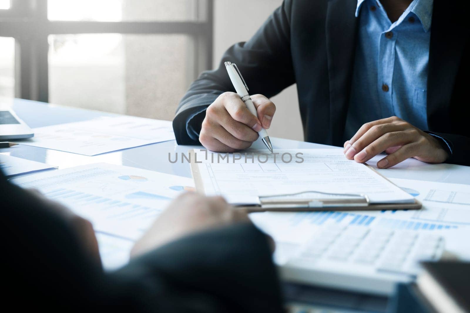 Business man sign a contract investment professional document agreement. by ijeab