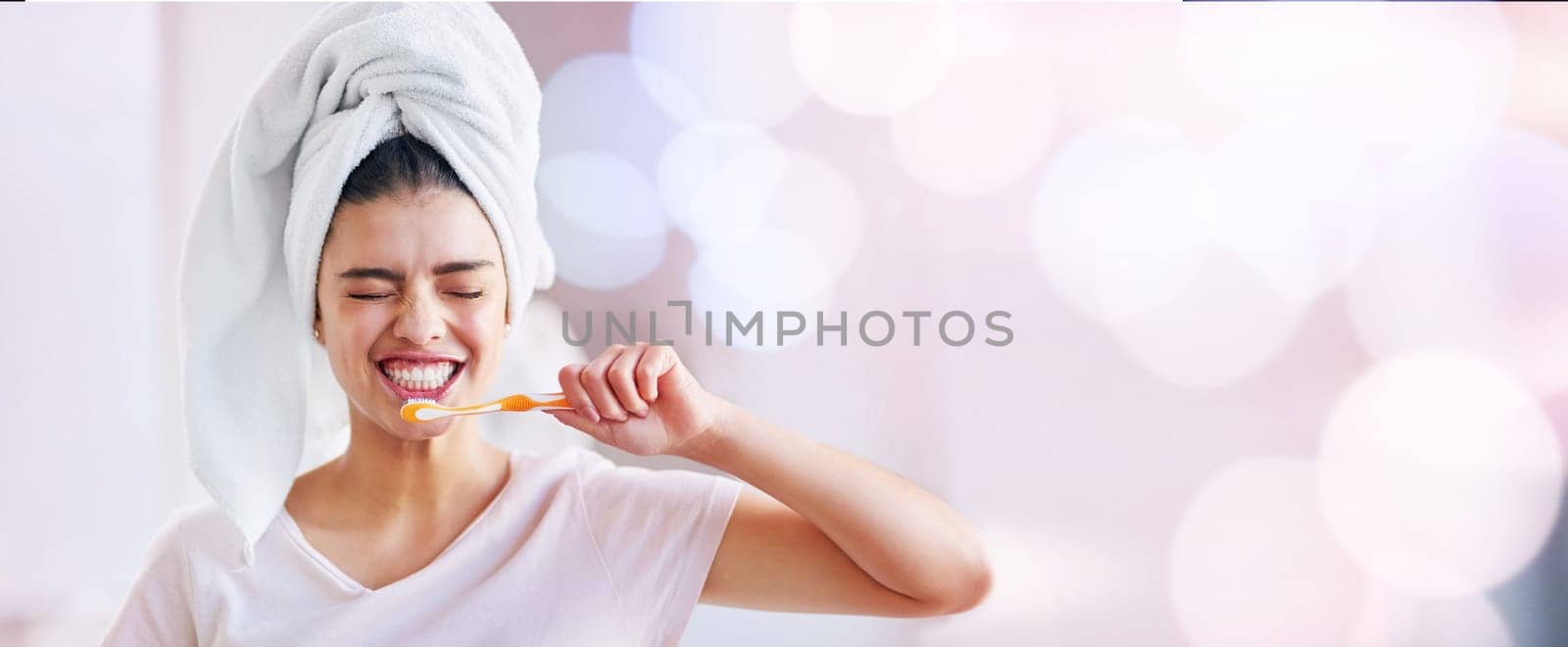 Woman, brushing teeth and smile by copy space mockup, bokeh and happiness for dental wellness. Gen z girl, toothbrush and mock up for happiness, start morning and healthy mouth in bathroom.