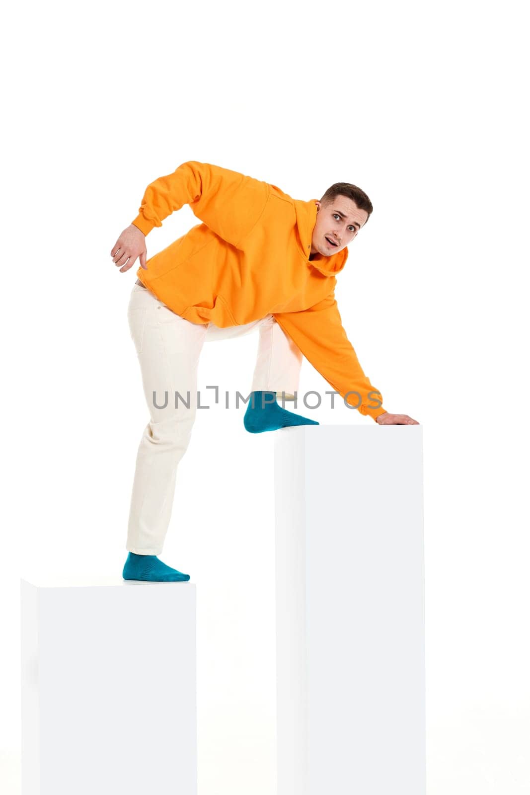 young man trying going up the bar chart. Business processes concepts. guy following up on white diagram