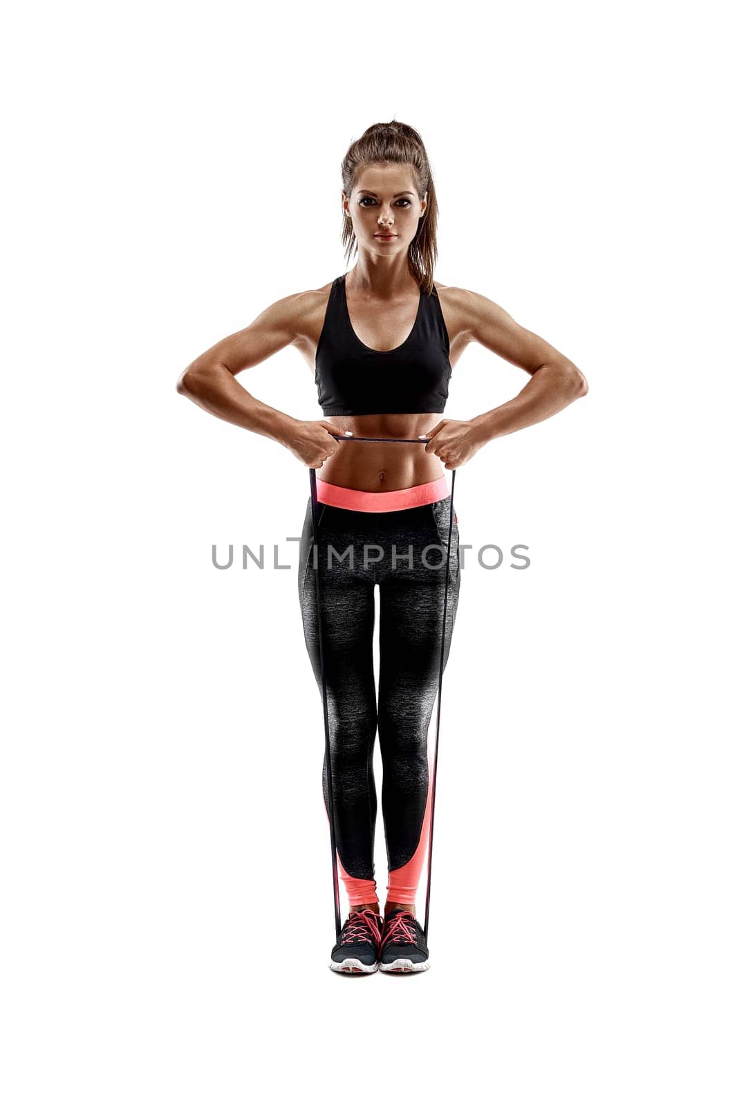 One caucasian woman exercising fitness resistance bands in studio silhouette isolated on white background