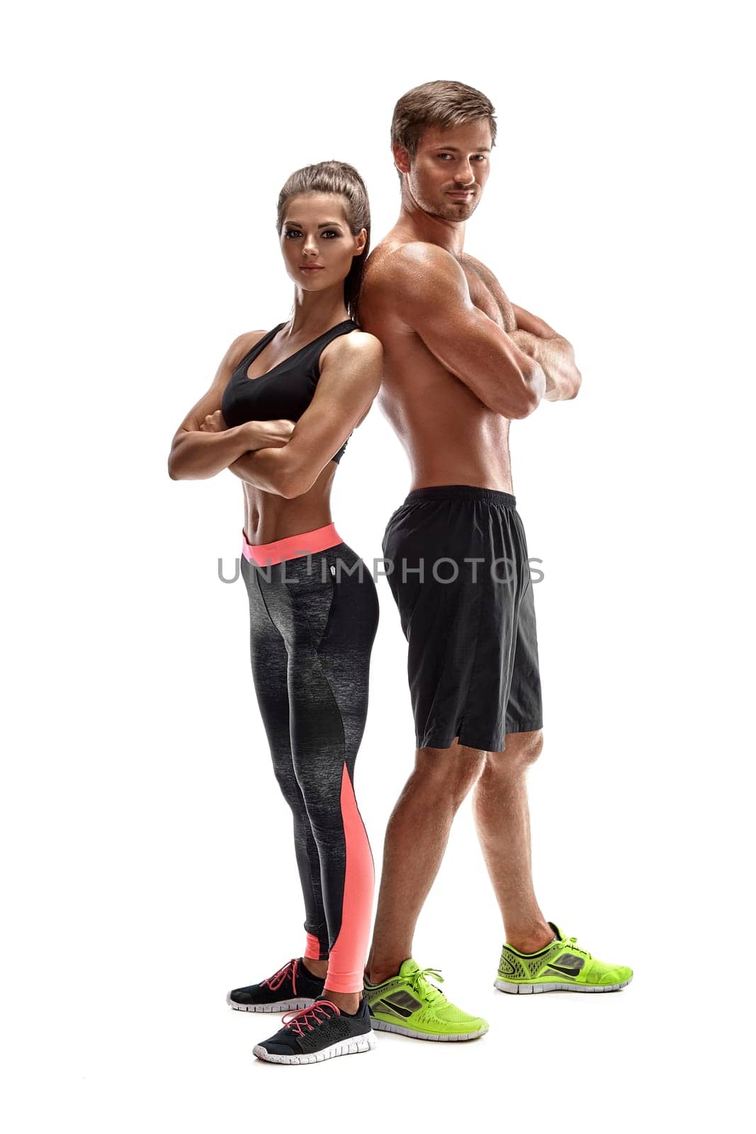 Young sportsmen couple woman and man in studio on white background by nazarovsergey