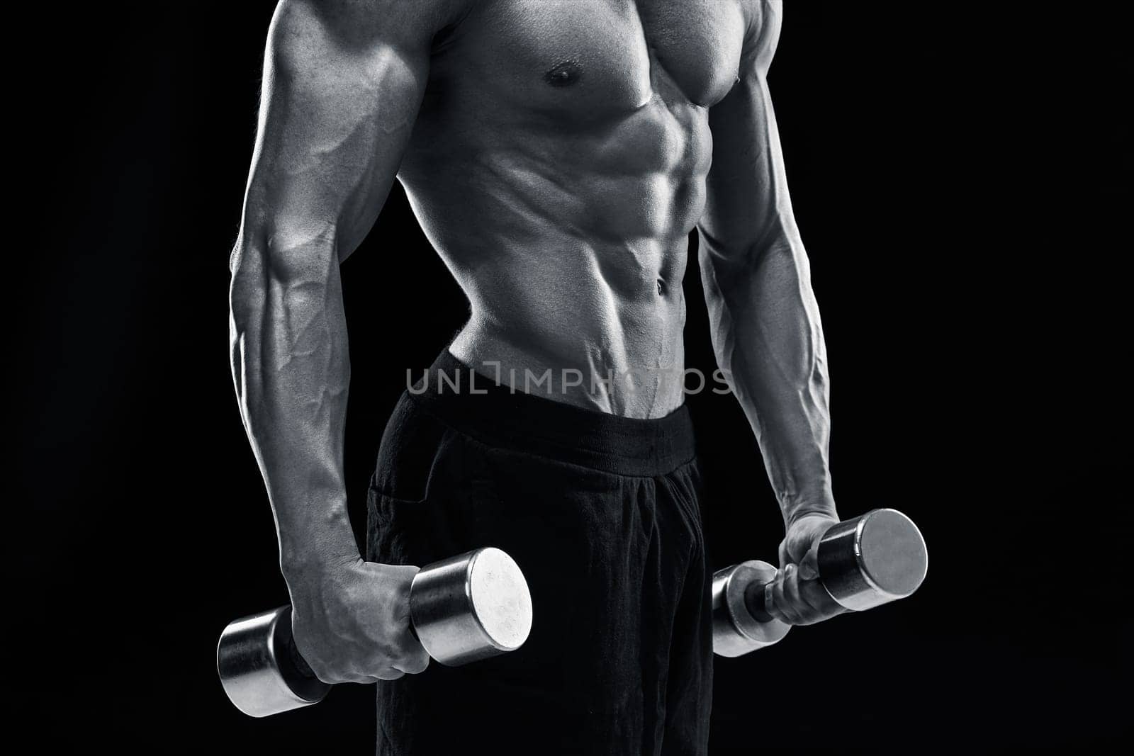 Muscular bodybuilder guy doing posing by nazarovsergey