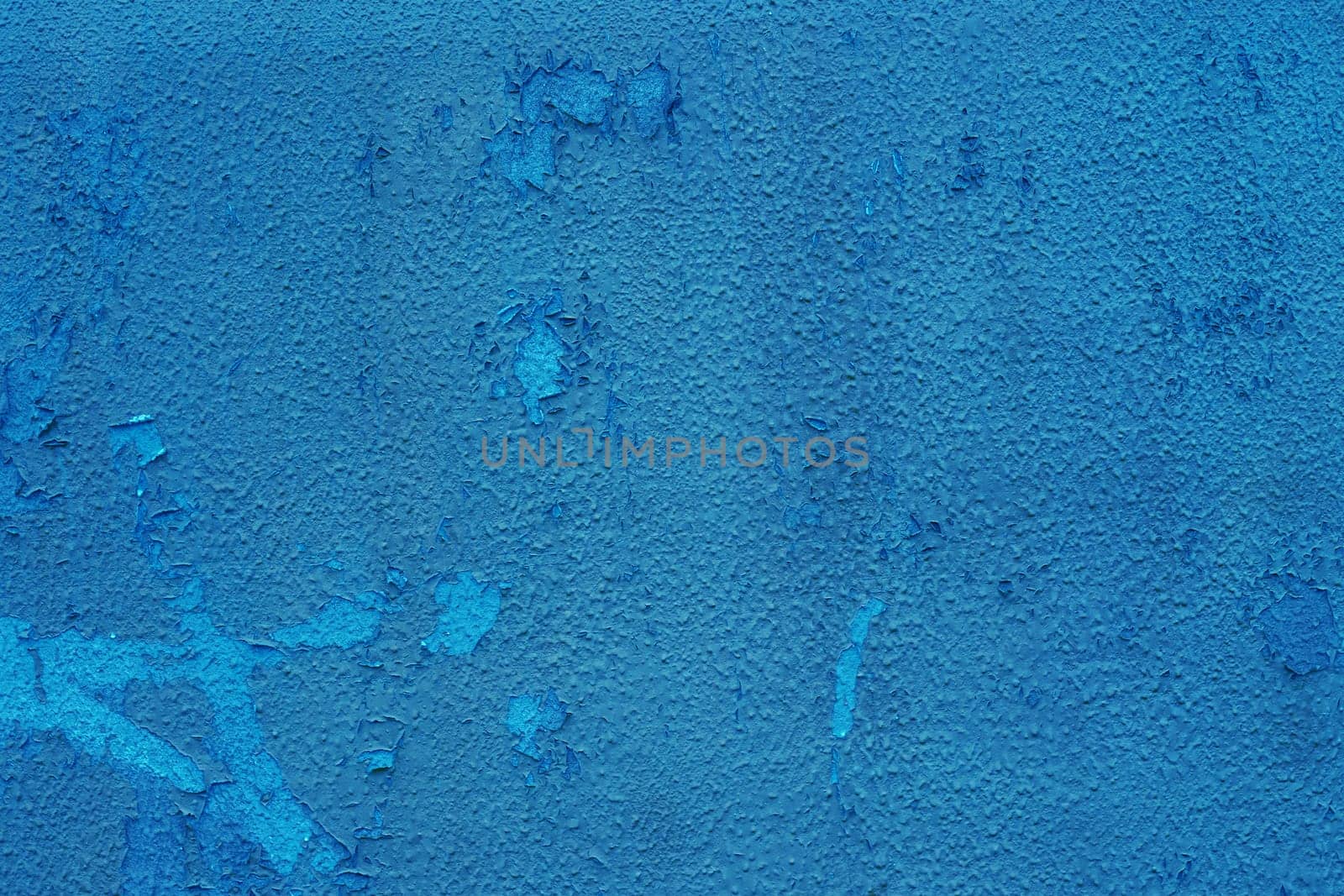 Abstract background for design with copy space. Blue peeling paint on the wall