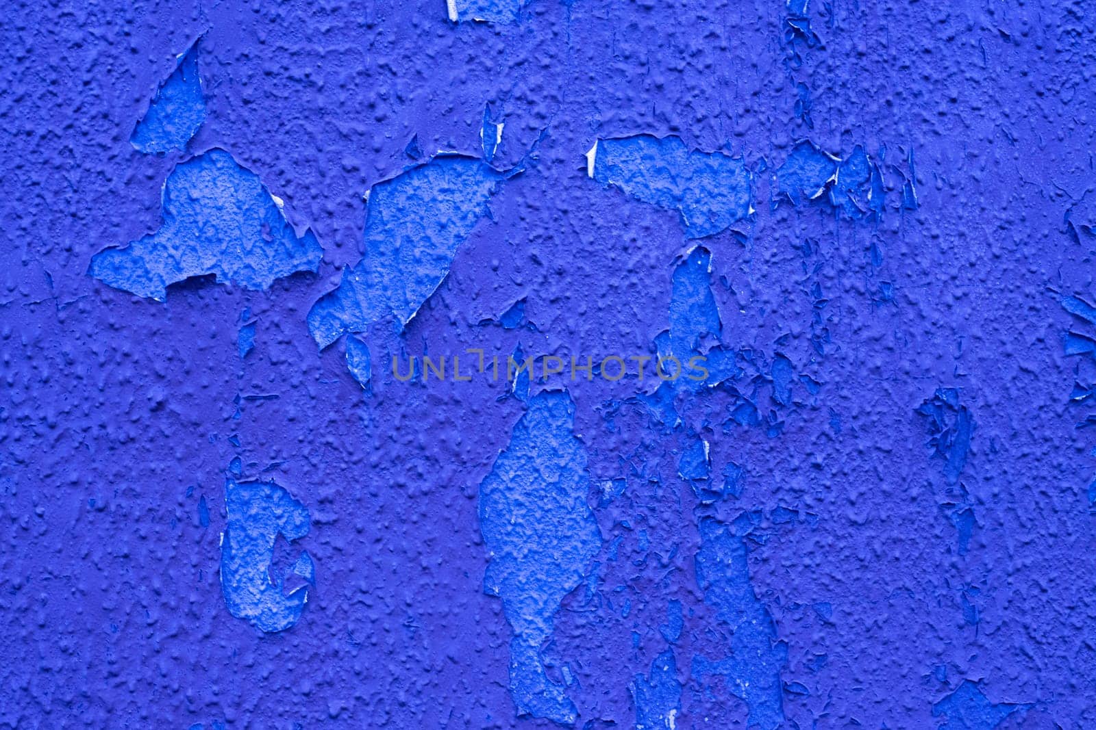 Old weather damaged blue paint on the wall. by gelog67