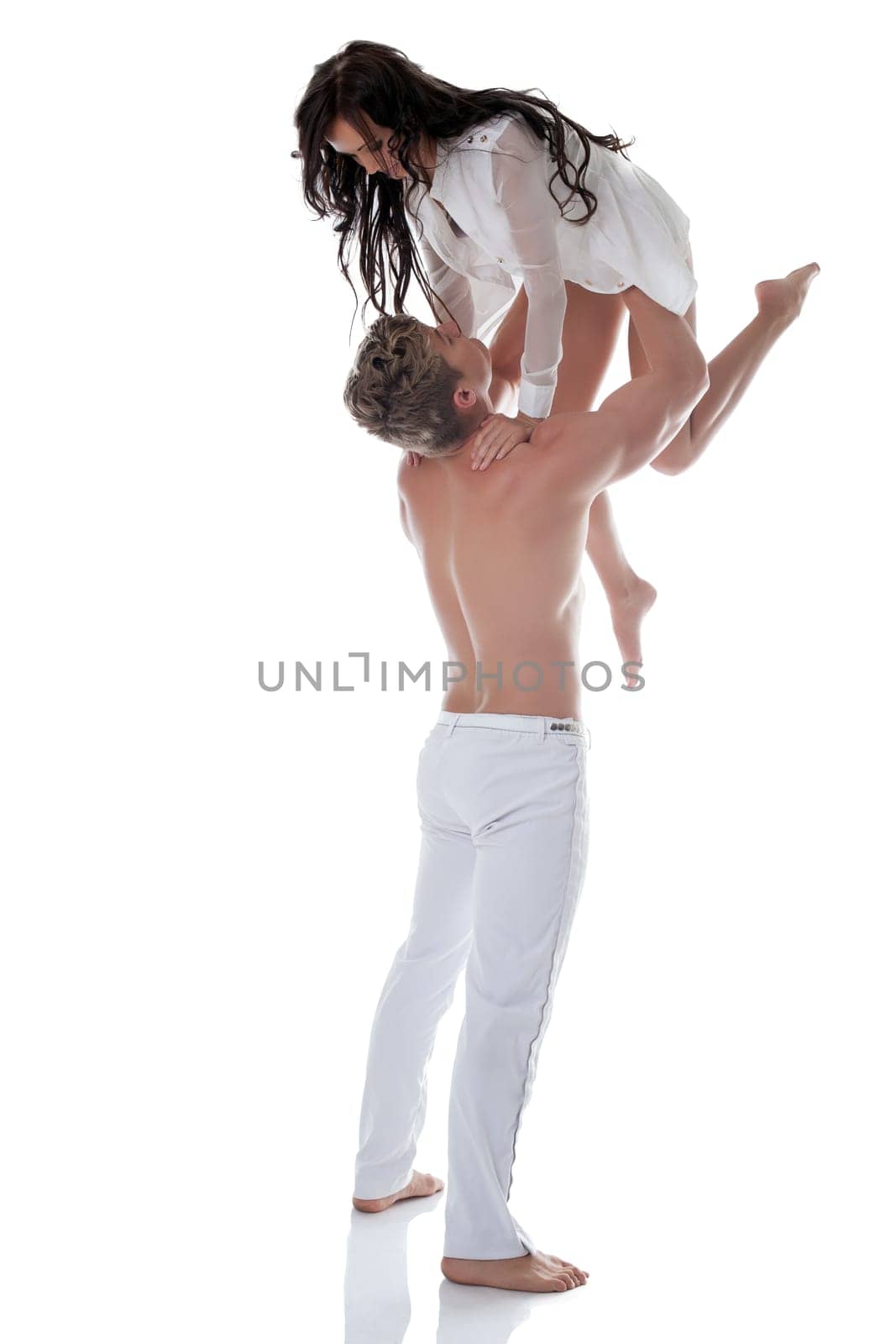 Elegant couple of dancers in studio, isolated on white