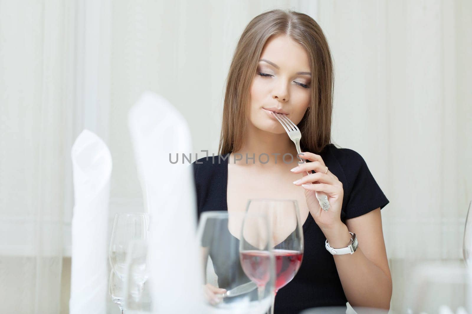 Portrait of beautiful girl posing in restaurant, close-up