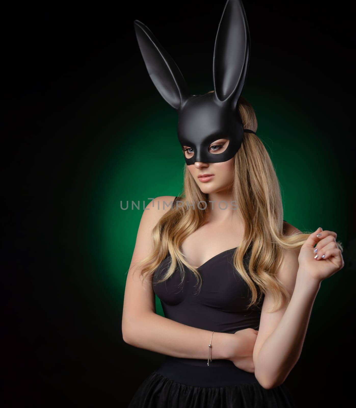 girl in a rabbit mask with beautiful eyes on a dark background