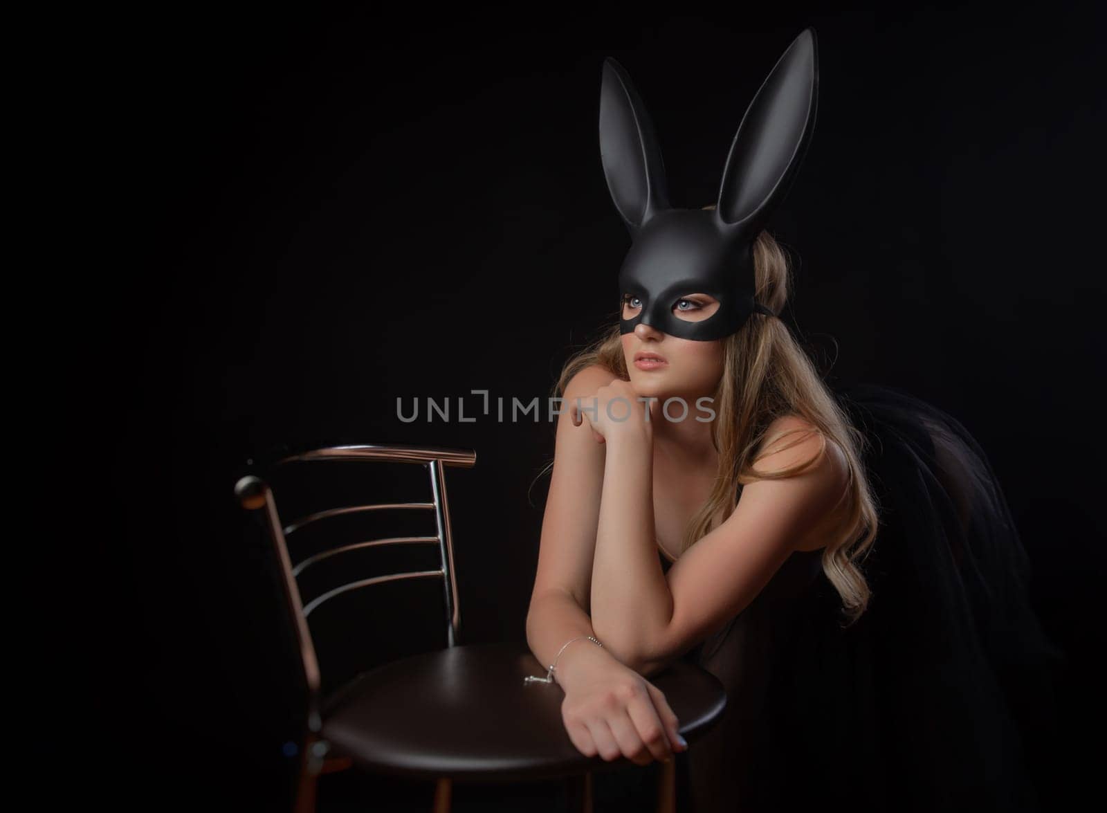 girl in a rabbit mask with beautiful eyes on a dark background by Rotozey