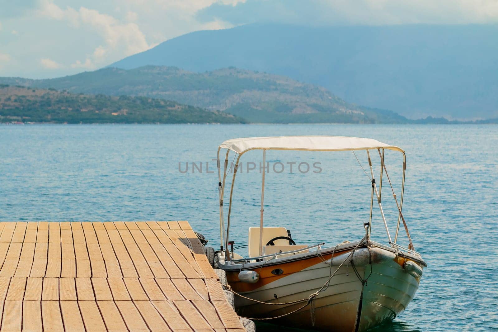 Motor boats drifting in the deep blue sea on Croatian coast.Adriatic Sea background.Crystal clear water,good sunny weather.Beautiful blue lagoon for summer vacation trip