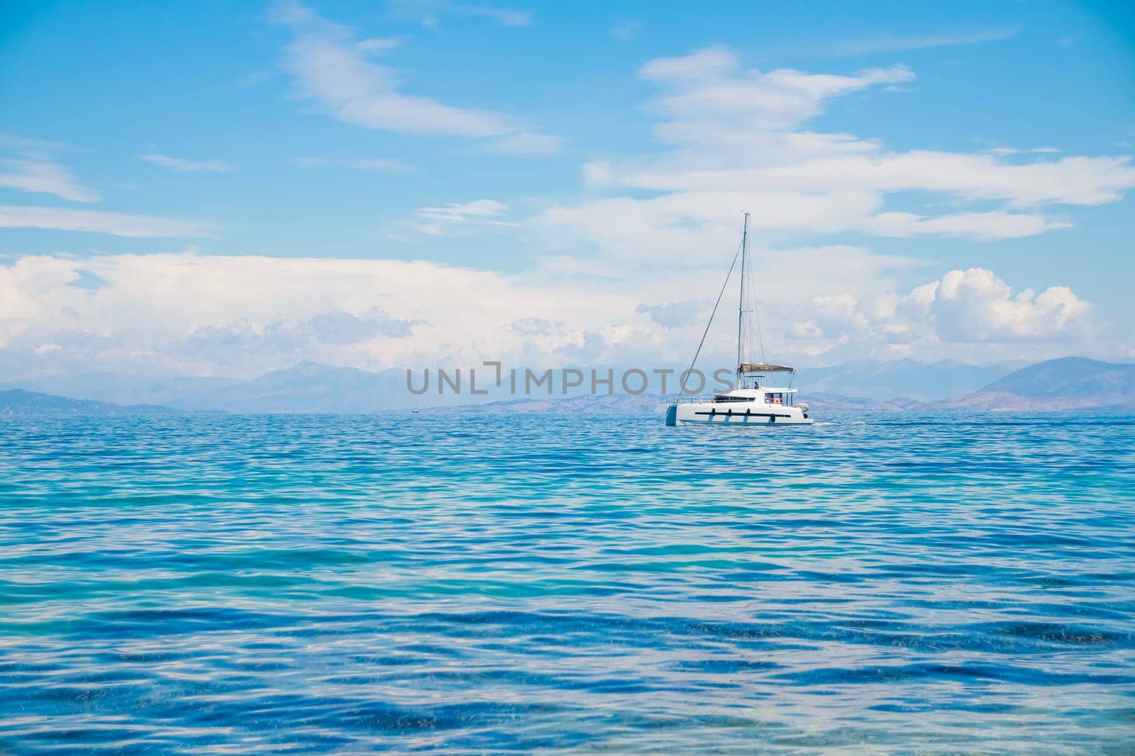 Catamaran at sea. Summer sport holiday.sailing boat near coast