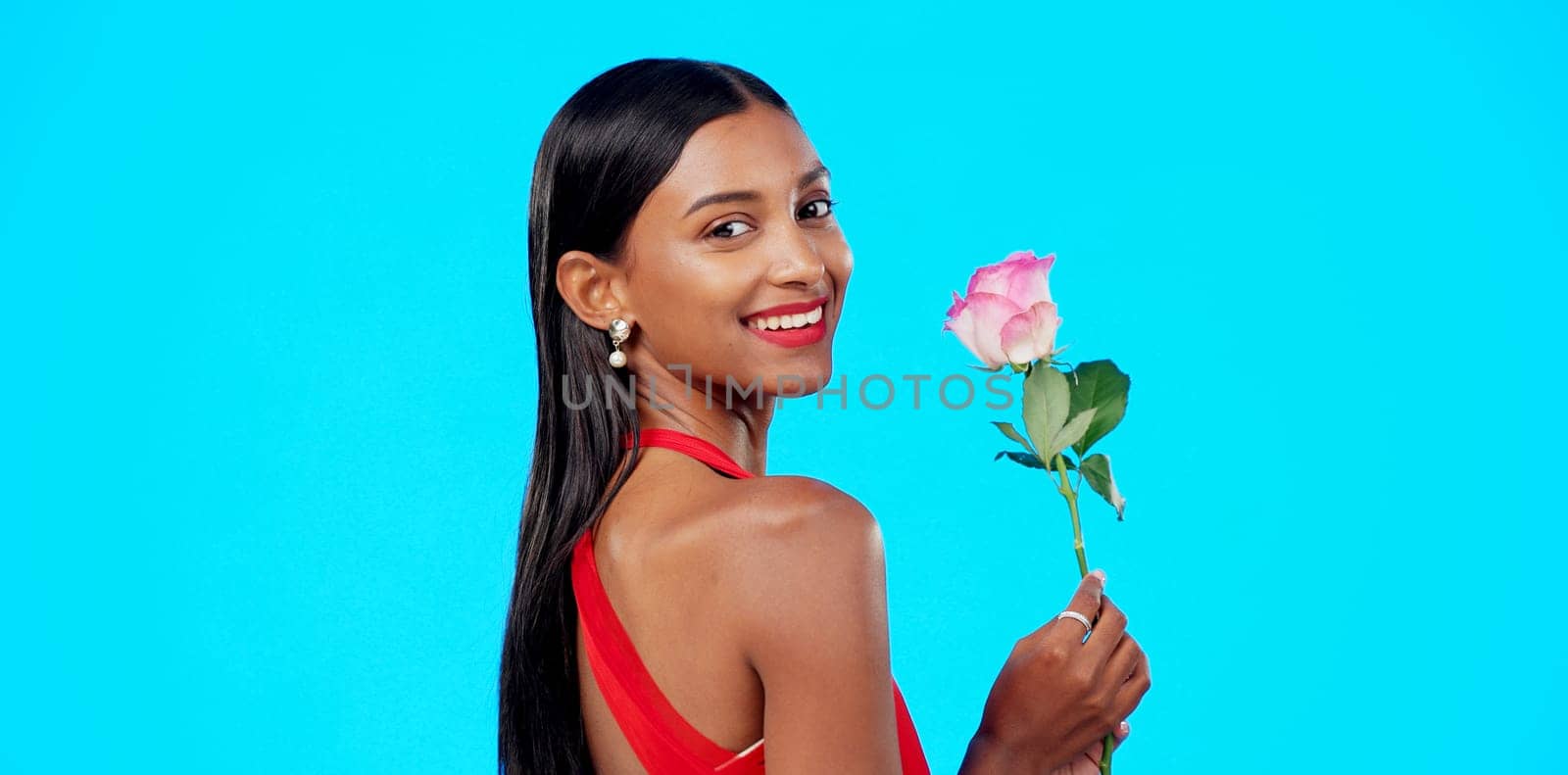Studio face, flower and beauty woman with nature plant, sustainable agriculture portrait and natural organic product. Eco friendly makeup, floral plant and skincare person portrait on blue background.