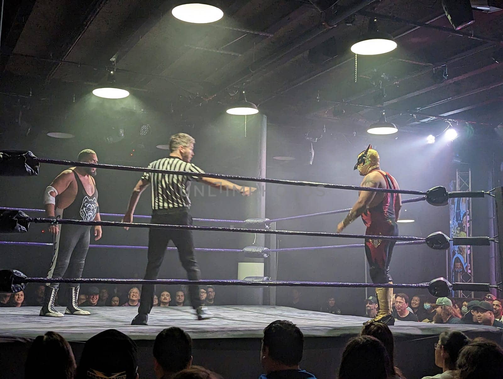 Honolulu, HI - December 22, 2022: Steve Michaels 'The Chicago Bearhug' (left) and El Guerrero Cuervo (right) battle it out in the ring at Uce Wrestling Anniversary.  It was an exciting match that will be remembered for years to come.