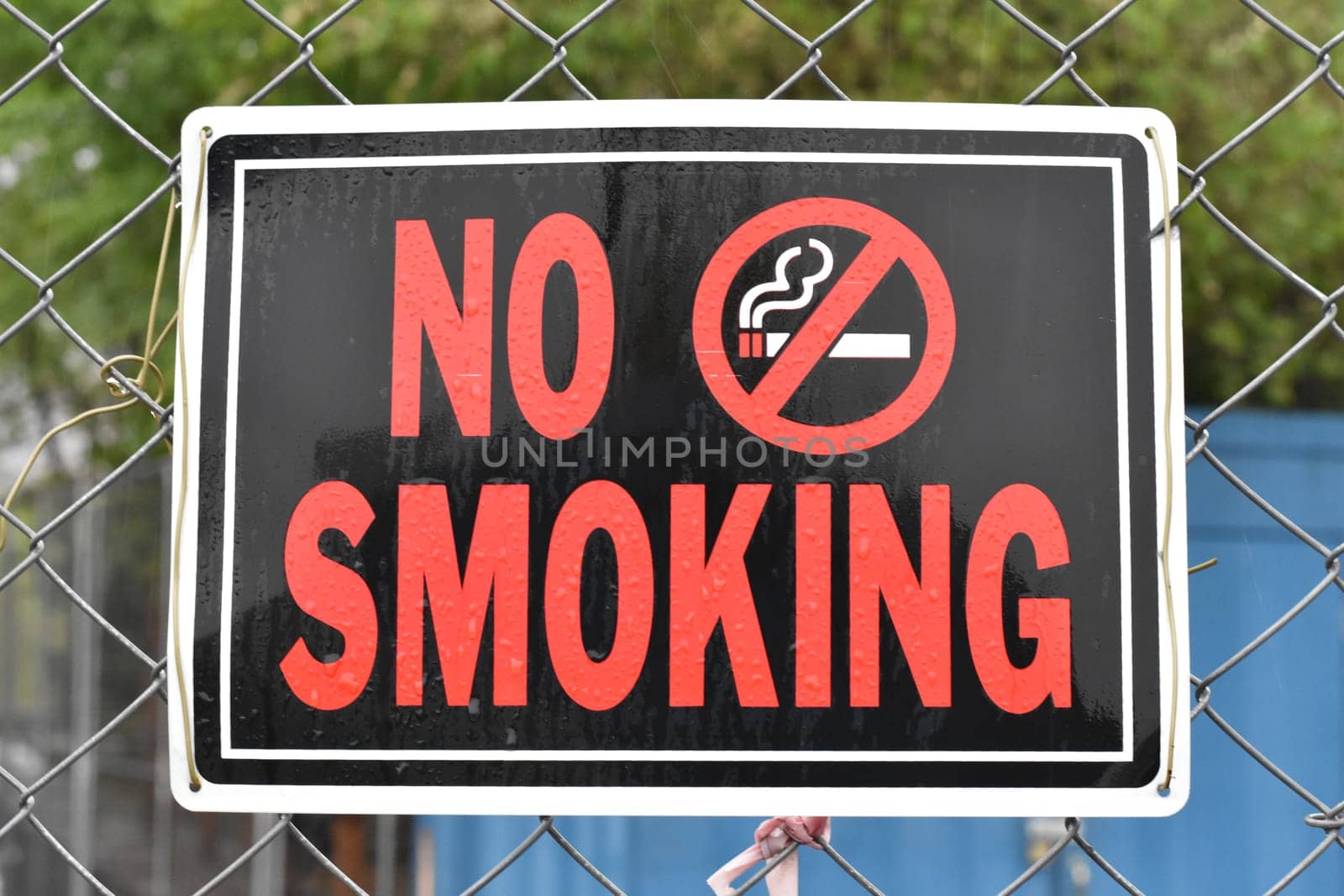 No Smoking Sign on a Construction Fence. High quality photo