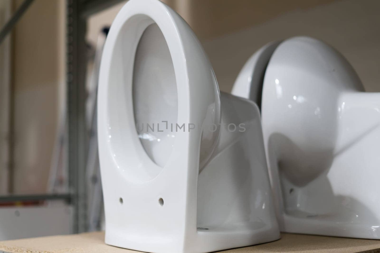 Lot of white toilets in a hardware store, plumbing department