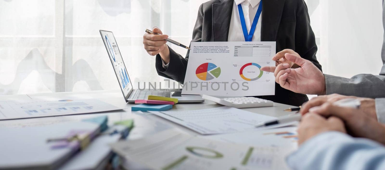 Business People Meeting using laptop computer,calculator,notebook,stock market chart paper for analysis Plans to improve quality next month. Conference Discussion Corporate Concept.. by wichayada