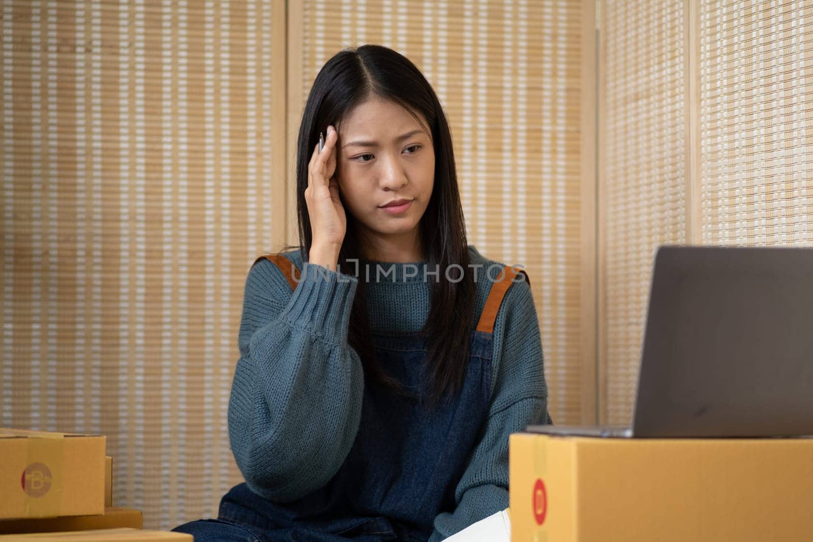 concern nervous serius tired stressed businesswomen think hard working at laptop for plan to sell online internet website webpage blog chat application advertising . High quality photo
