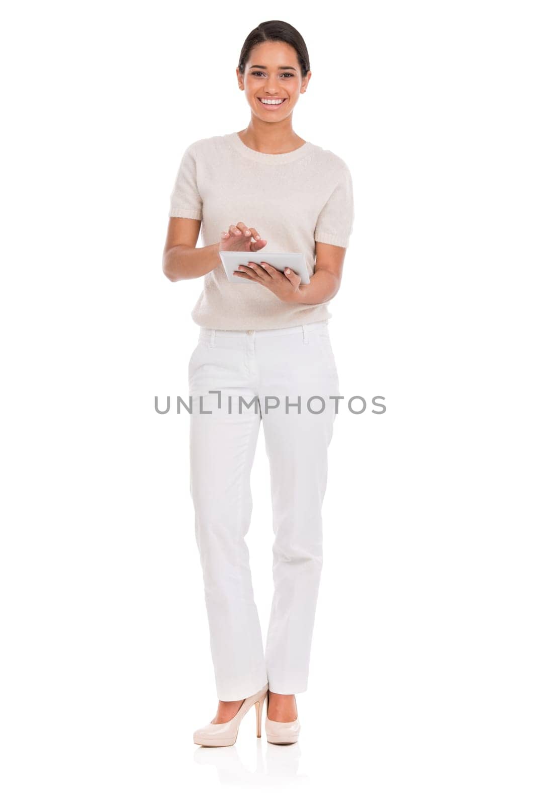 Technology works for her. Full-length portrait of an attractive young woman using her tablet
