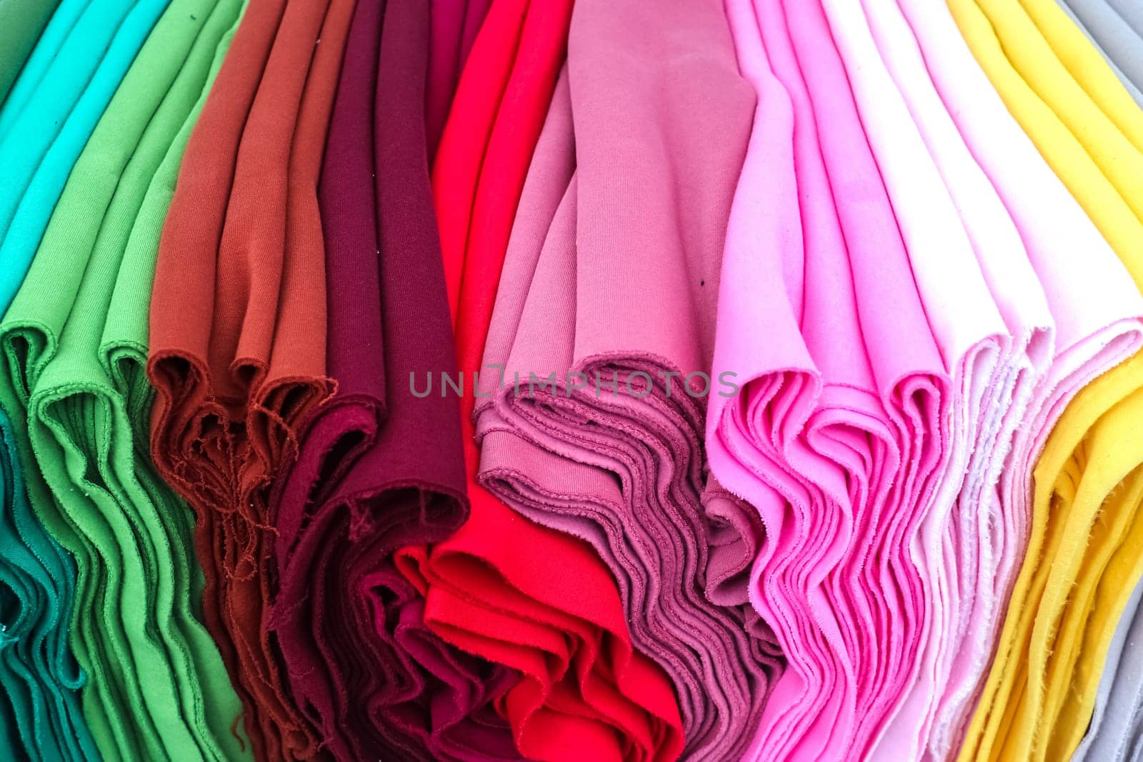 View on samples of cloth and fabrics in different colors found at a german fabrics market. by MP_foto71