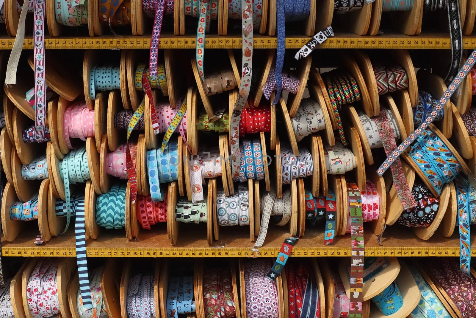 Samples of cloth and fabrics in different colors found at a fabrics market.