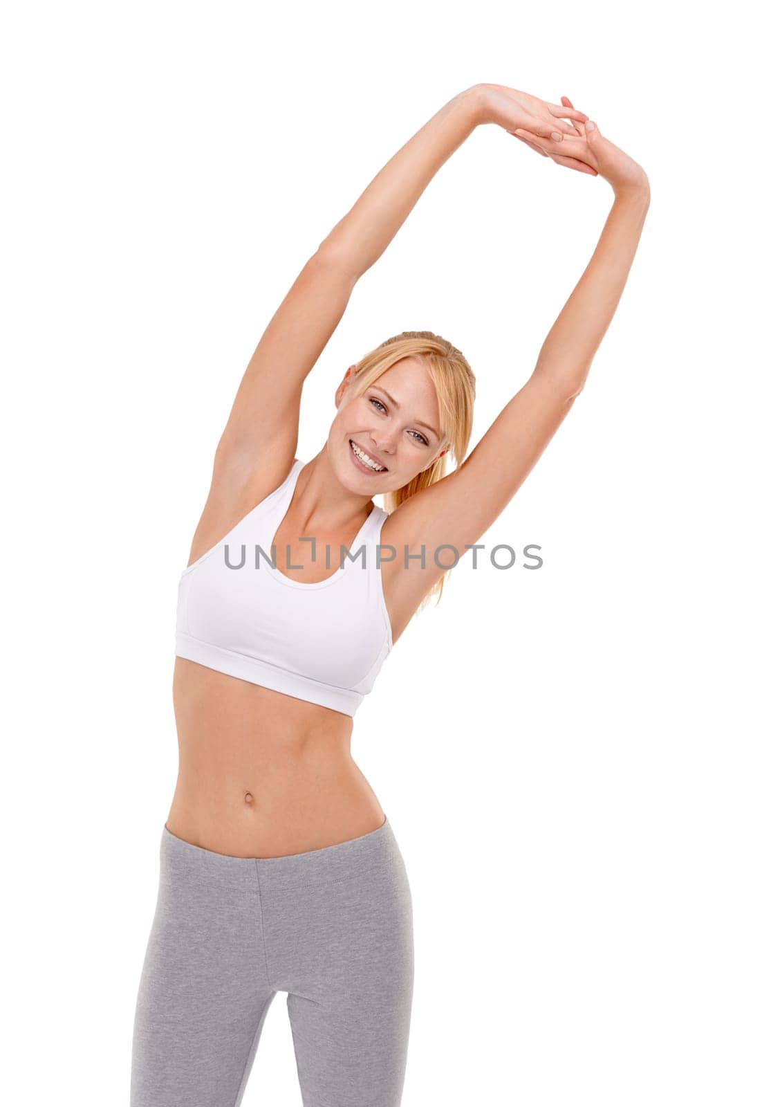 Its important to warm up and stretch. an attractive young woman warming up before a workout