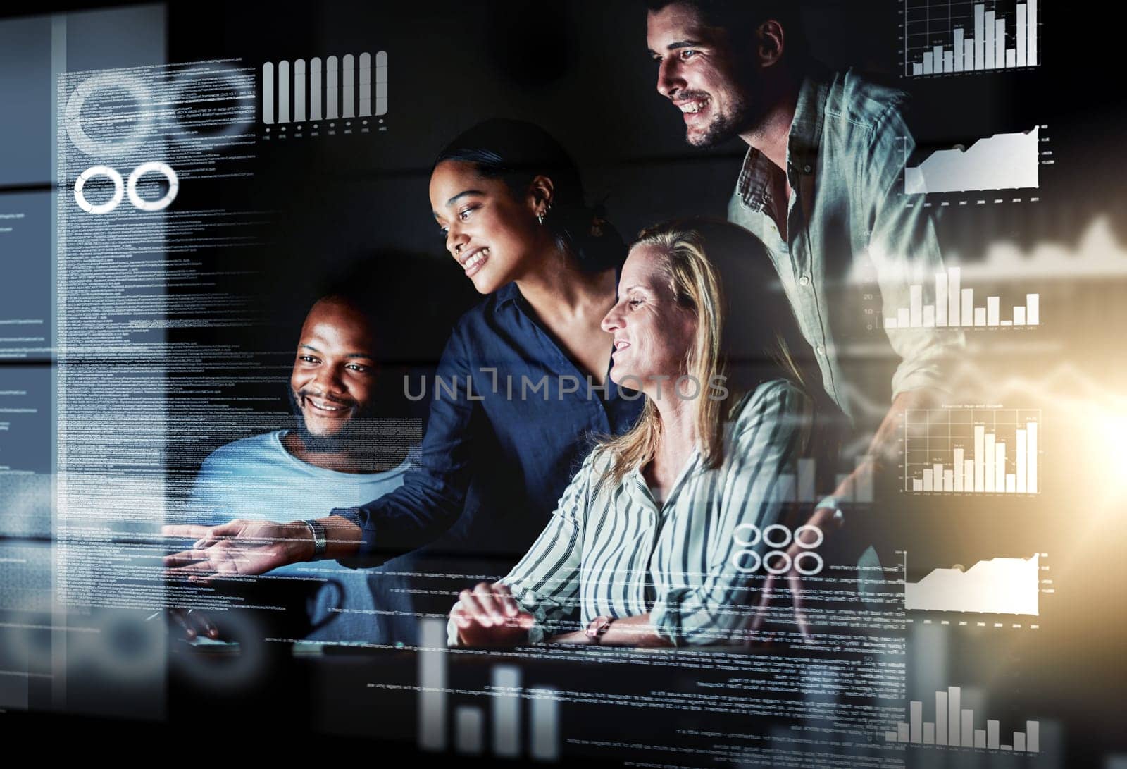 Shot of a group of programmers working together on a computer code at night.