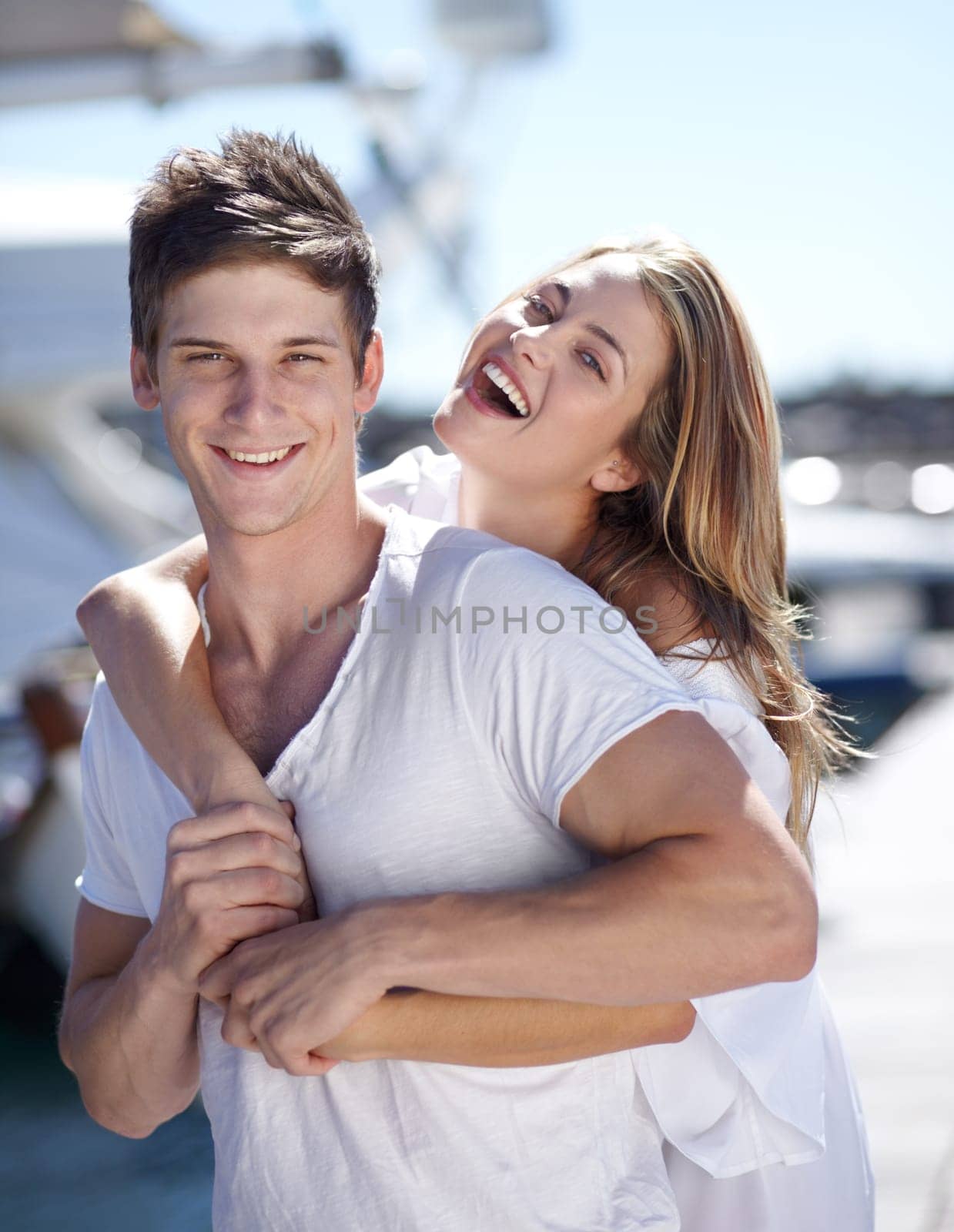 Happiness, love and portrait of couple on a date together feeling happy on a romantic vacation or holiday in summer. Portrait, travel and woman hug man in a relationship and smile outdoor with care by YuriArcurs
