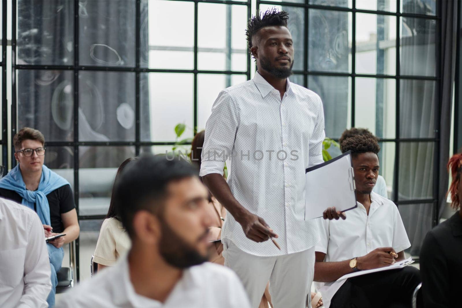 Business colleagues in conference meeting room during presentation