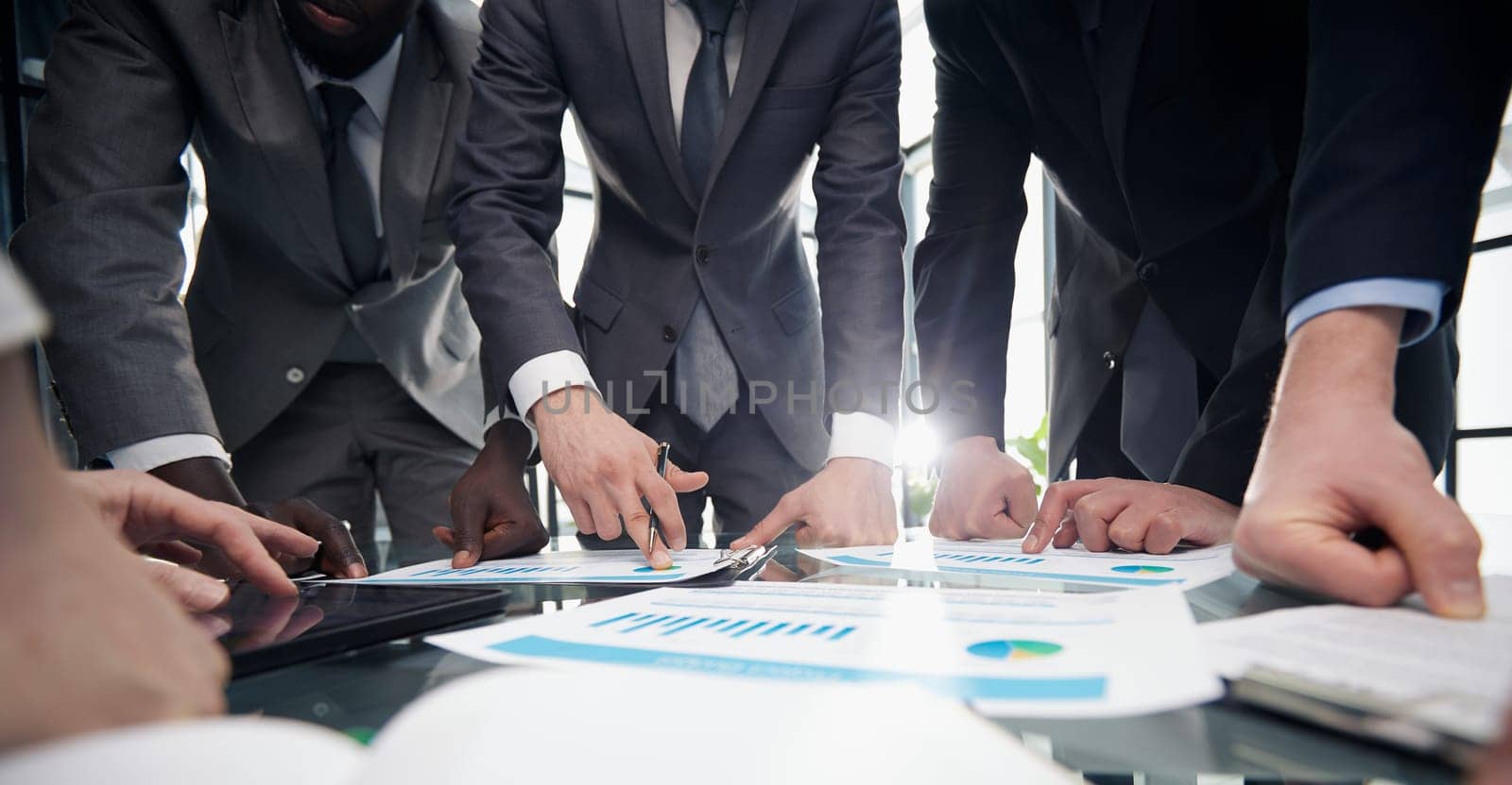 employees are brainstorming in the office of a technology startup