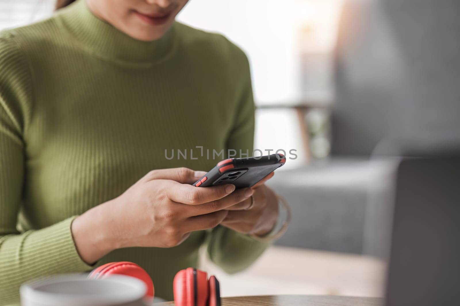 Close up woman using smart phone with hand finger touch screen, texting, chatting or social media..