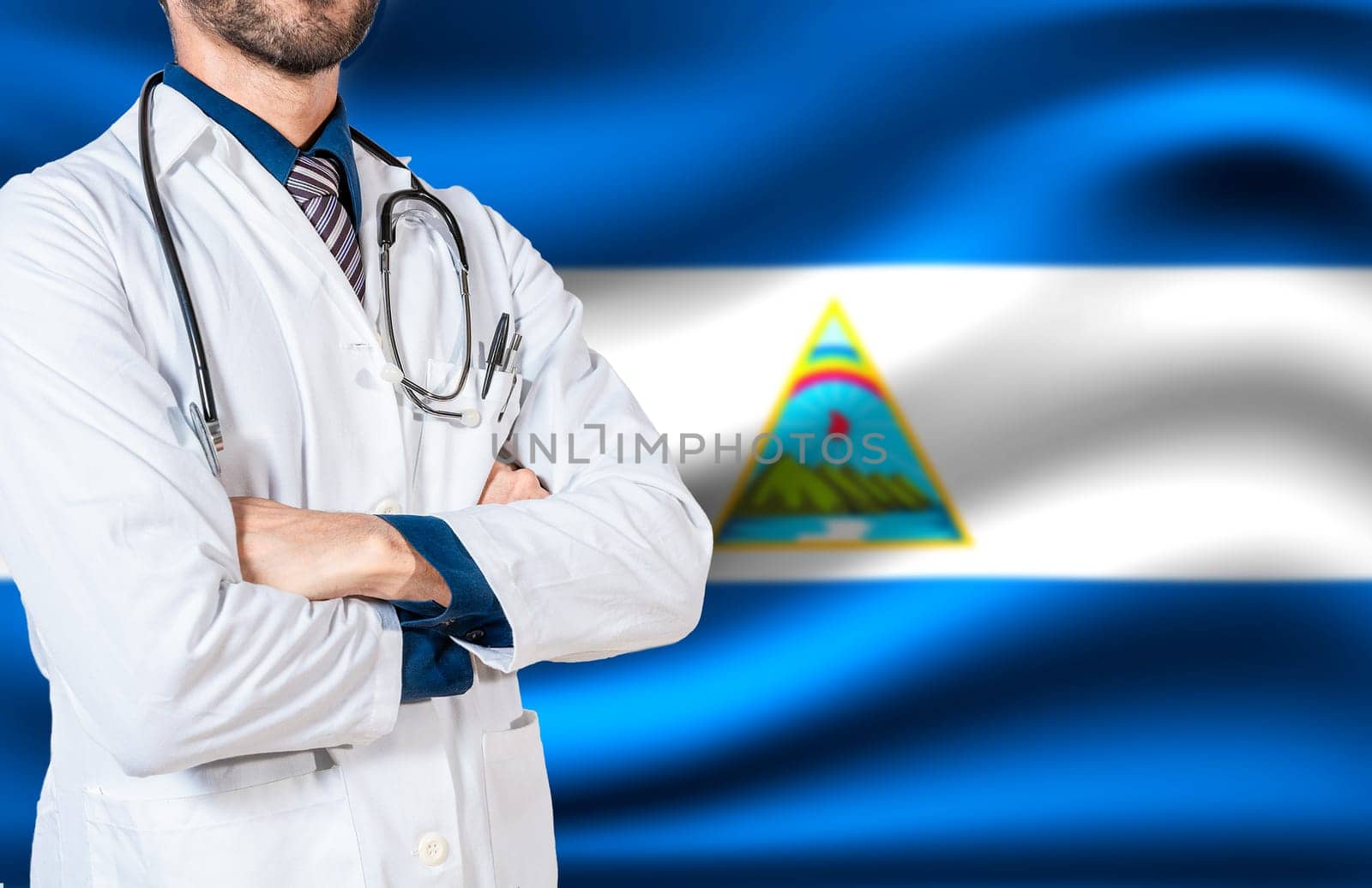 Nicaragua national health concept, Doctor with stethoscope on Nicaragua flag. Doctor arm holding stethoscope on nicaragua flag, Health and care with the flag of Nicaragua by isaiphoto