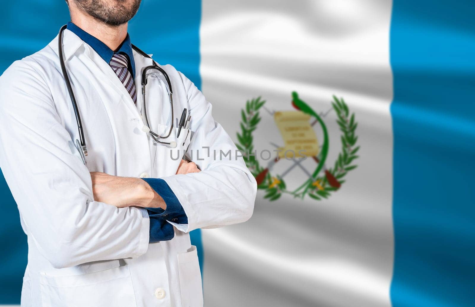 Health and care with the flag of Guatemala. Doctor with stethoscope on guatemala flag. Guatemala national health concept, Doctor arm with stethoscope on Guatemala flag