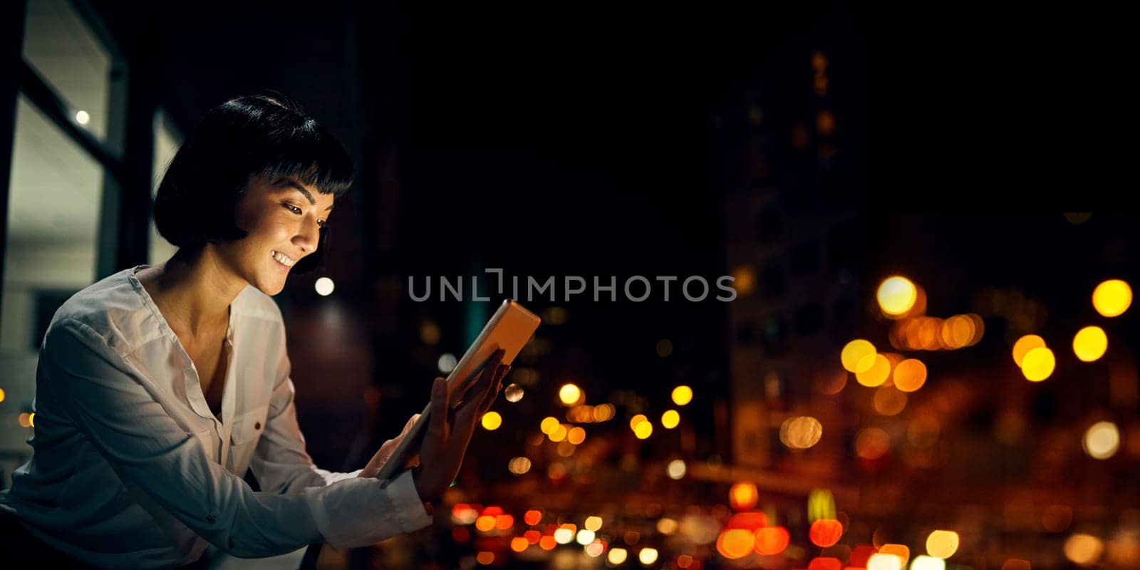 Smile, night and tablet with woman on rooftop for research, social media and networking app. Technology, internet and website with girl outside for email, communication and data in city bokeh mockup.