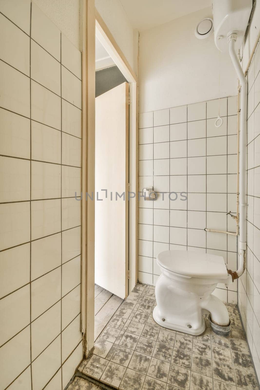 a small bathroom with a toilet and a shower by casamedia