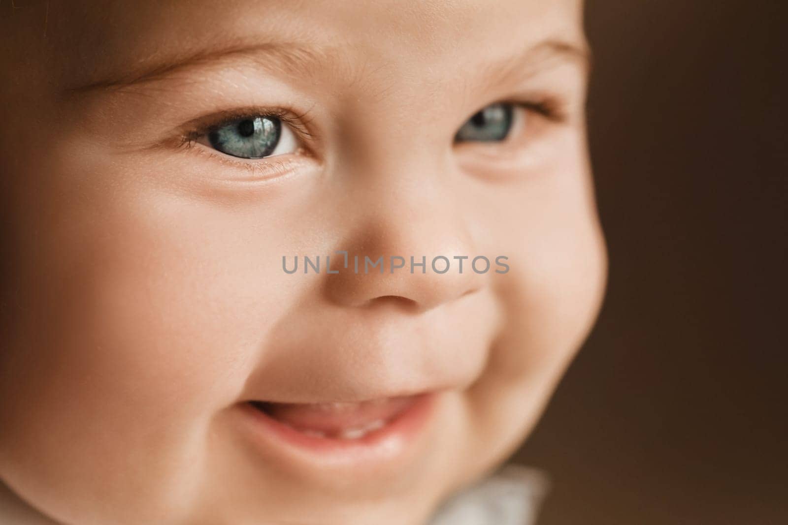 Close-up of a cheerful little boy in the background.