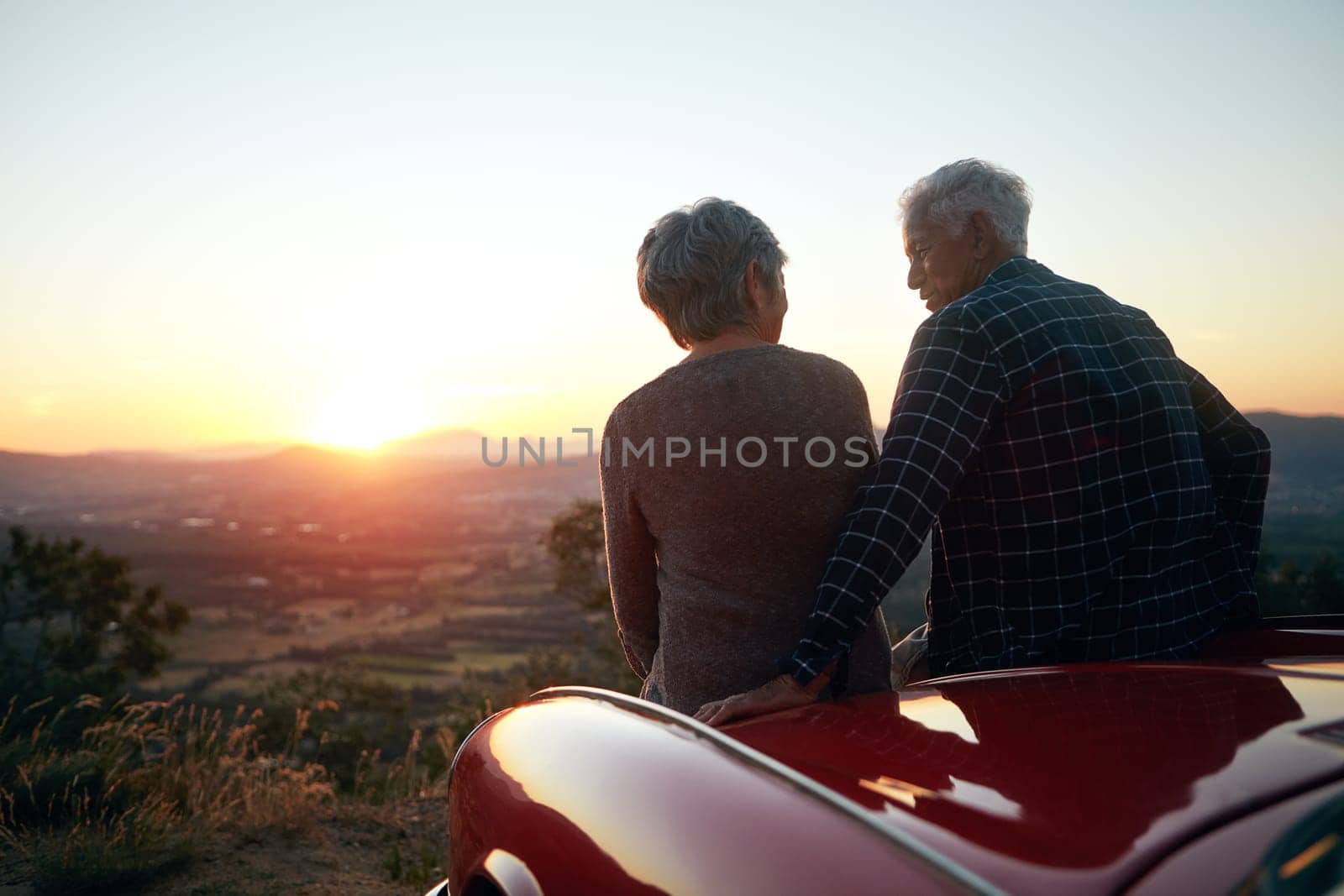 Nothing like travel to enrich your life. a senior couple enjoying a road trip. by YuriArcurs