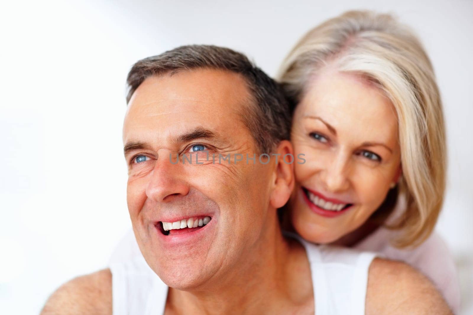 Romantic couple having fun against white background. Detail shot of a romantic couple having fun against white background