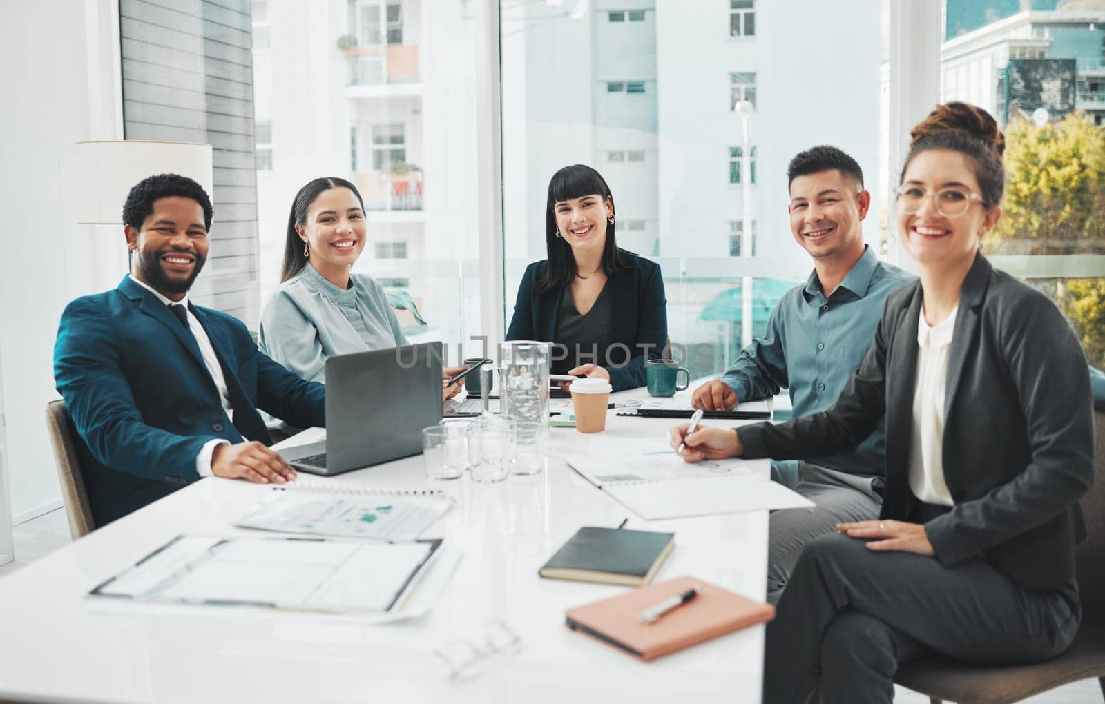 Happy, portrait and business people in meeting in office for planning, brainstorm and problem solving. Team, face and collaboration by group with diversity, idea and motivation for startup goal plan.