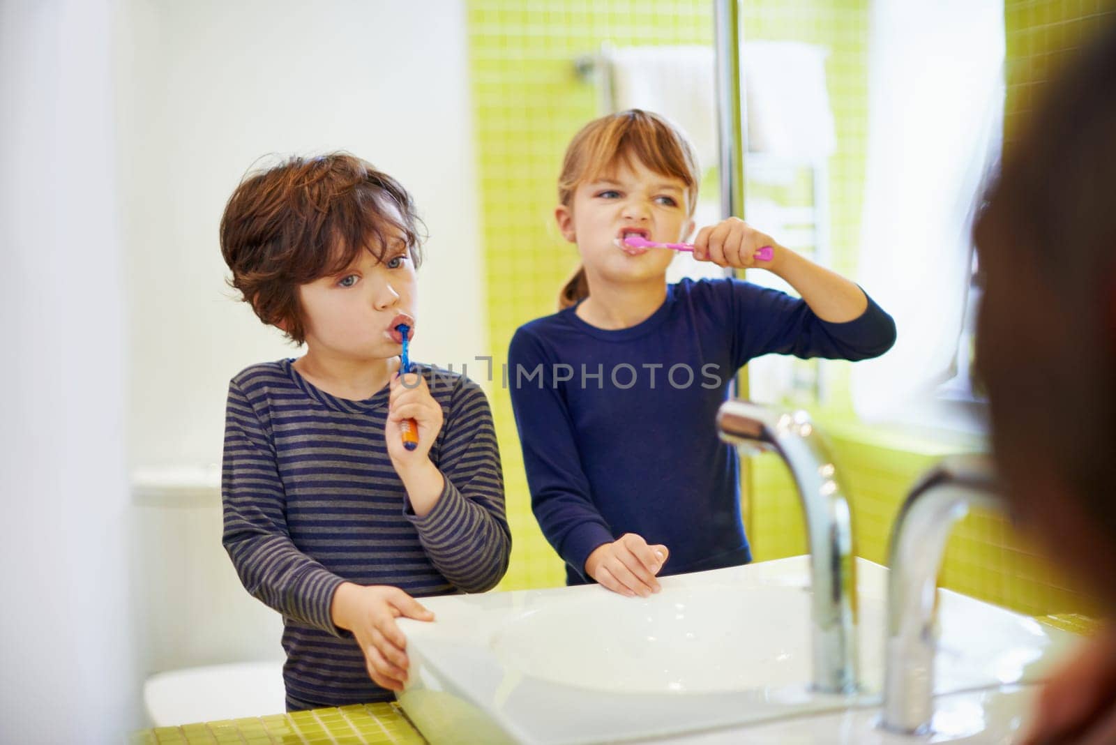 Children brushing teeth in home bathroom with toothbrush for hygiene and clean mouth. Oral healthcare or fresh breath, kids grooming while bonding and wellness with dental care at sink for dentist by YuriArcurs