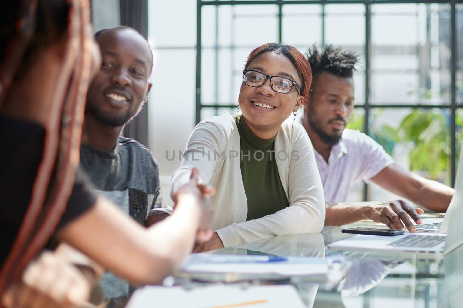 African american hr team welcoming female applicant at job interview by Prosto