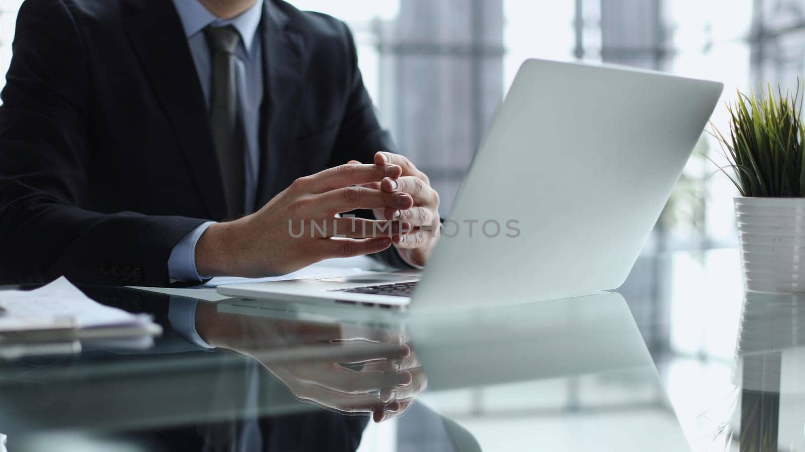 Close-up of male hands typing laptop keyboard. man using laptop